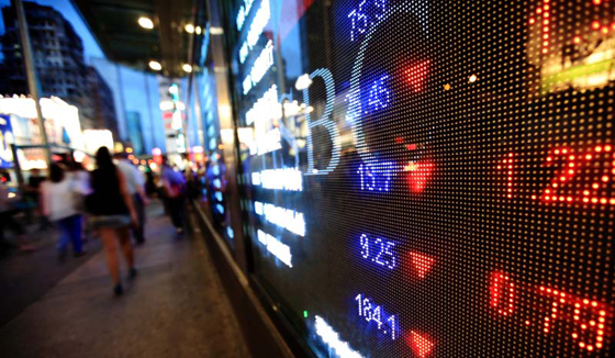 Photo: Stock Ticker Boards along Busy Street